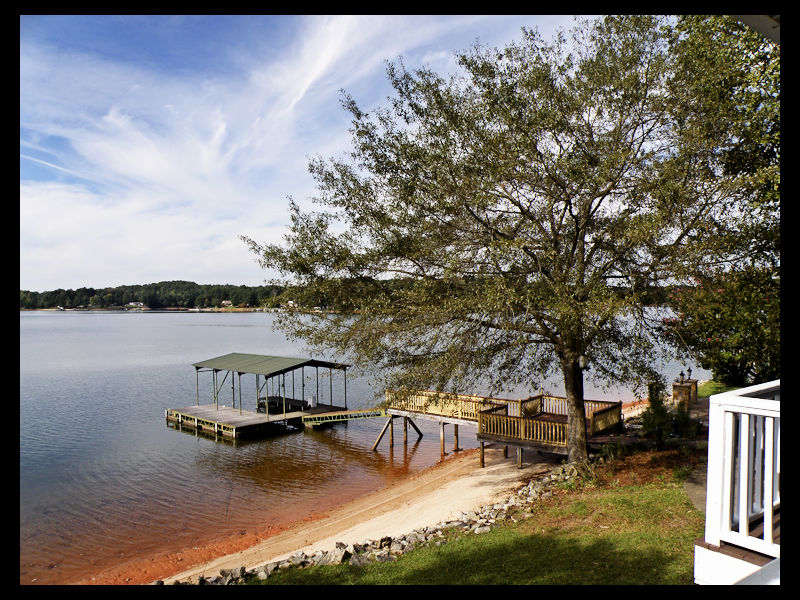 Pier and covered dock at this Lake Keowee home